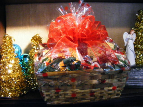 Custom holiday gift basket with red ribbon