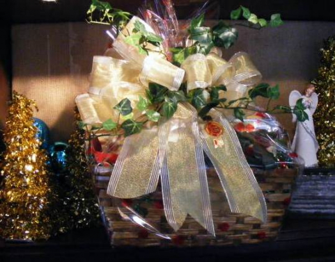 Custom holiday gift basket with gold ribbon